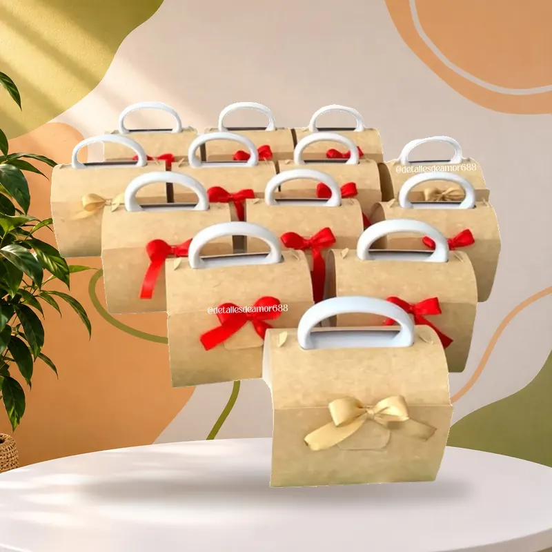Cajas kraft con manija y moño, armadas por cantidad para entrega corporativa